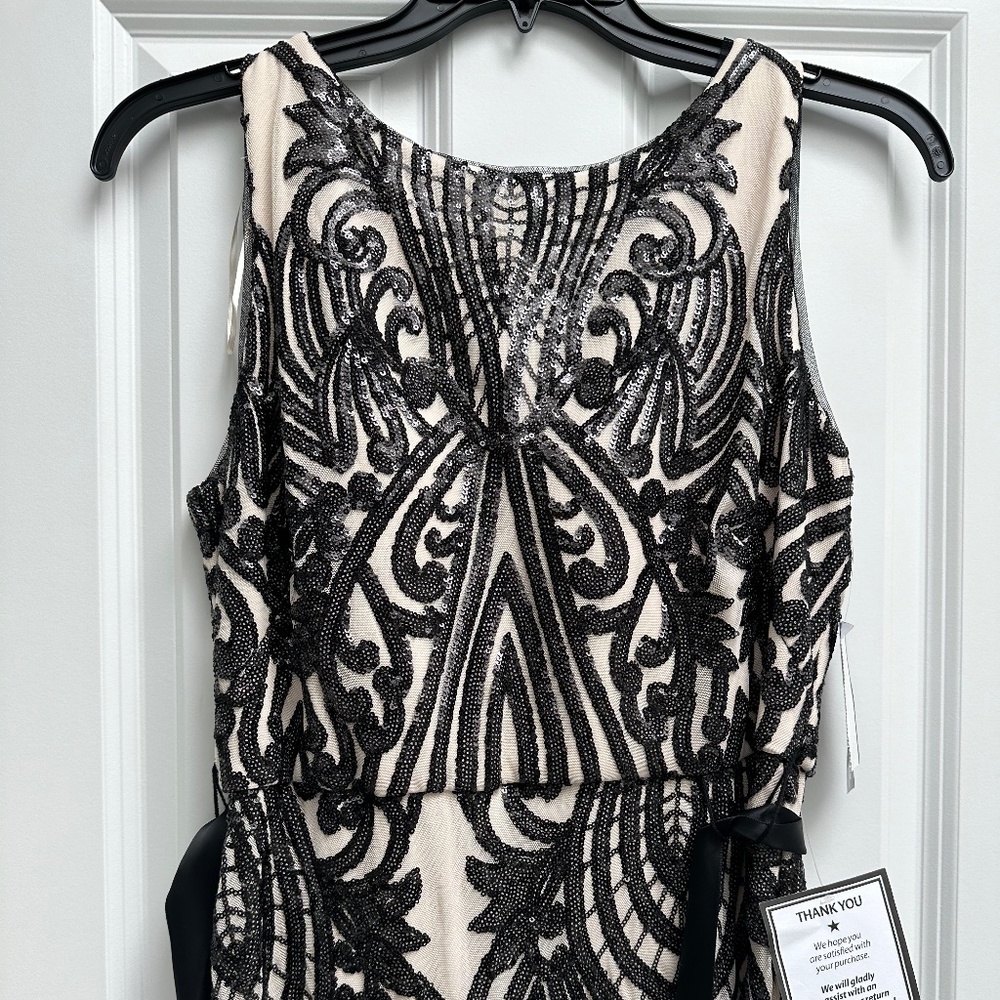 New with tages black sequin and nude gown/dress